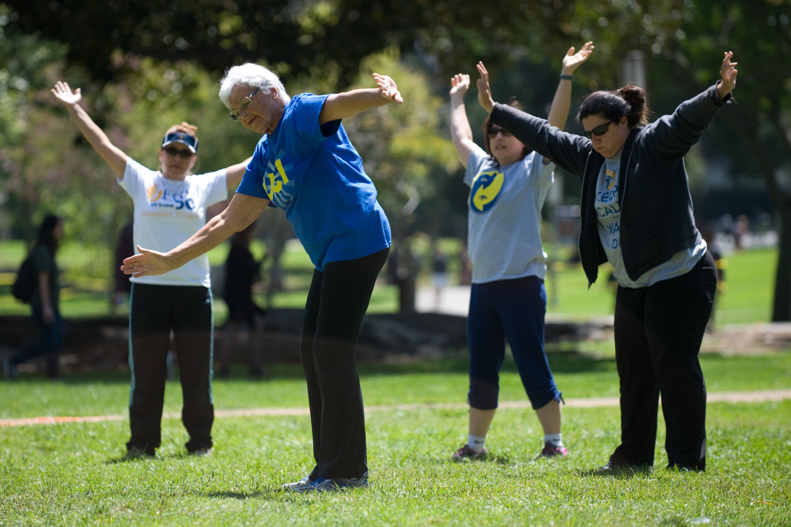 Olga Connolly leads a workout class in Aldrich Park. Now a staff member with UCI Campus Recreation, she achieved world fame in 1956 when she won an Olympic gold medal for Czechoslovakia and an American athletes heart.