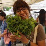 Girl holding a bunch of lettuce